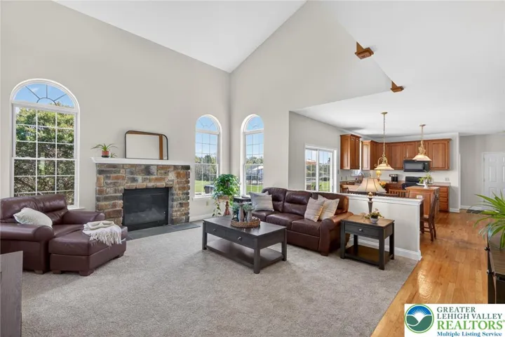Family room with gas fireplace and soaring ceilings