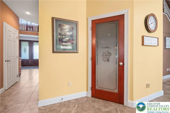 The walk-in pantry offers alot of storage, and your guests won't confuse it with a powder bath, a closet or the basement!  Attention to detail!