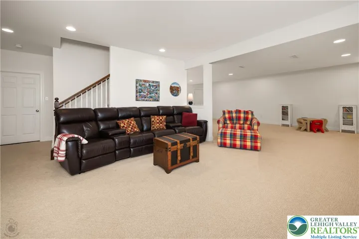 Welcome to the lower level family room!! Great kids' space, man cave, second work space, craft area ... with closets, bookshelves and storage cabinets.