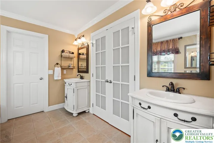 Separate vanities.  The single door opens into the "shower" room.