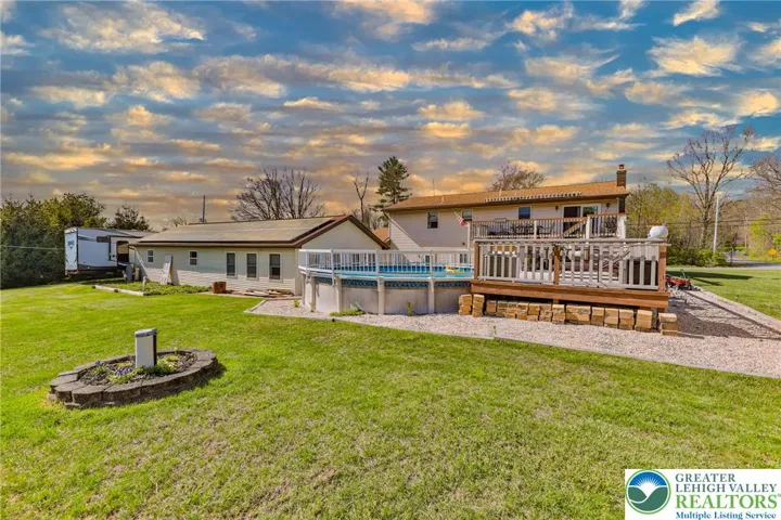 Rear view of home, pool and deck