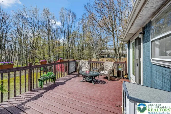 The newer Back Deck features over 230sf of outdoor living space and overlooks the back yard.
