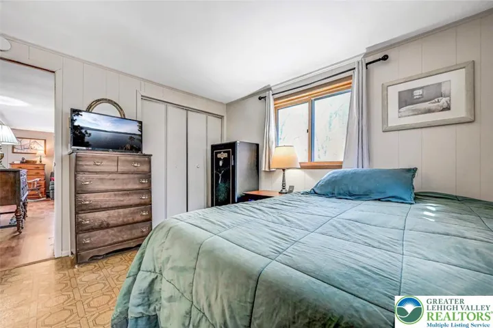 Bedroom 1 features a double closet and can accommodate a King sized bed with accent pieces.
