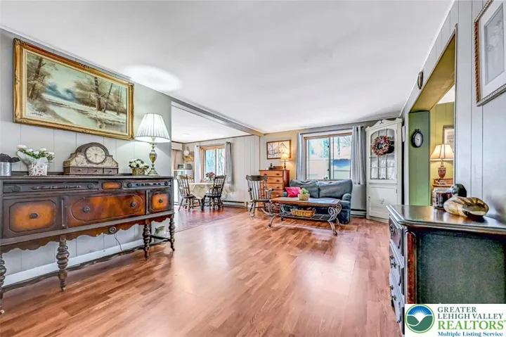 The Living Room has laminate flooring throughout and has been freshly 
painted.