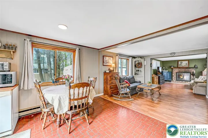 View of the Dining Area off the Kitchen featuring a large double wood-clad window.

