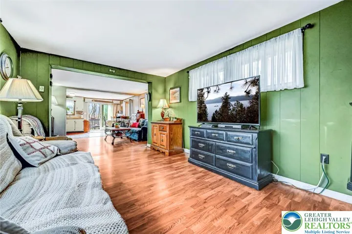 The Family Room has laminate flooring throughout and has been freshly painted.
