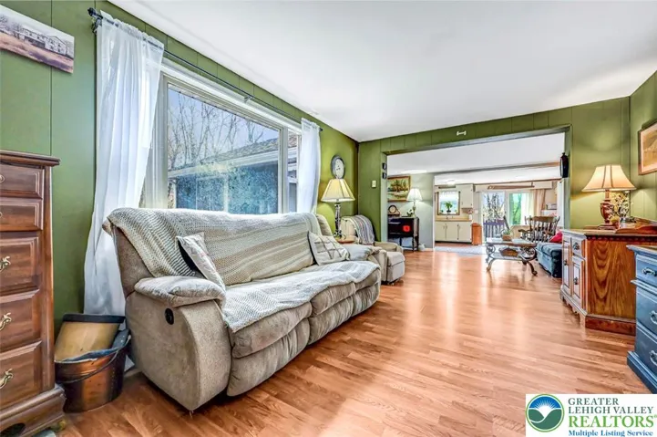 The Family Room is very bright with double windows and a large picture window overlooking the front deck and yard.
