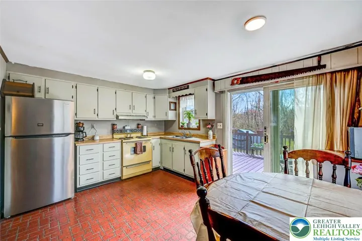 The Dining Area is off the Kitchen and leads out through large sliders to the back deck.
