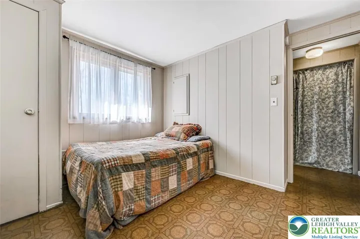 Bedroom 2 has a single closet and can accommodate a Queen sized bed with accent pieces.
