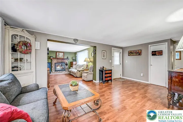 The Living Room includes a coat closet and large double window for plenty of natural light.

