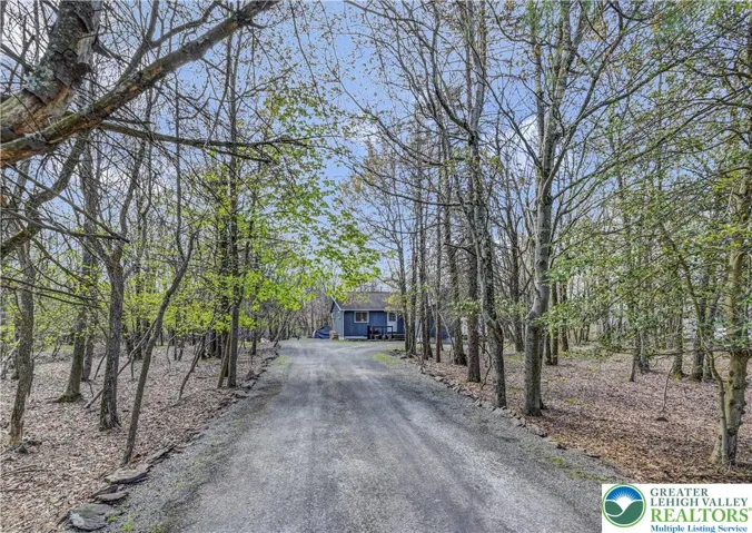 The home sits back from the street for privacy and the lot is large and flat throughout.
