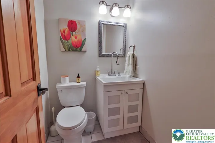 Half bath with designer utility sink cabinet