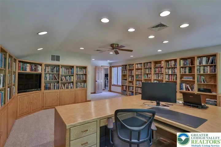 Second floor library/office with built in shelving and desks