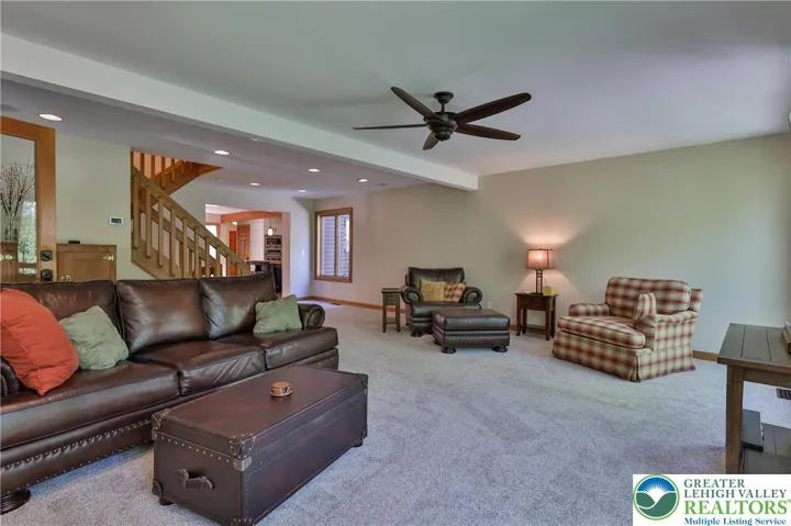 Family room off the kitchen with access to screened porch