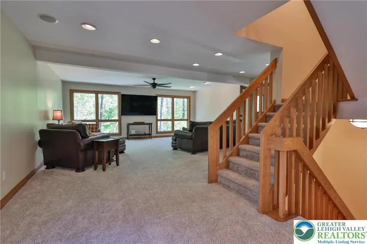 Entry to family room from kitchen and stairs to the second floor library/office