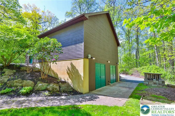 Lower level of the 2 car garage for lawn equipment/ATV storage