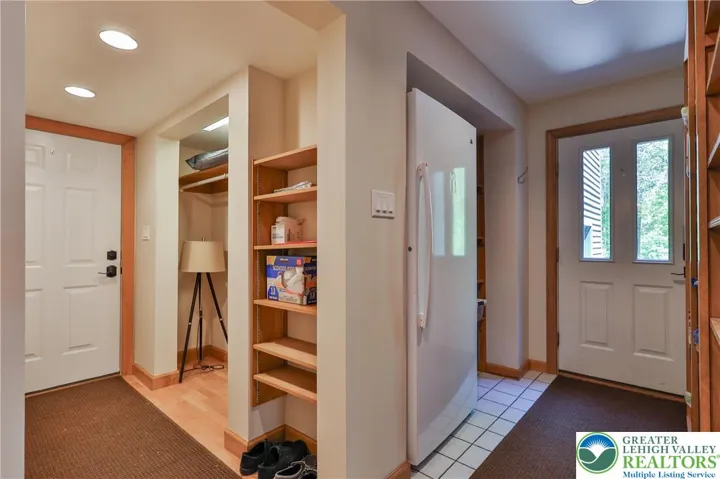 Garage & side door entry foyer