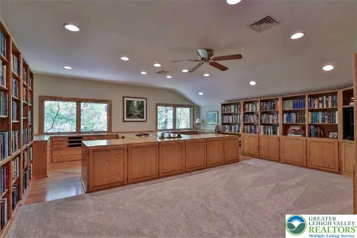 Second floor library/office with built in shelving and desks