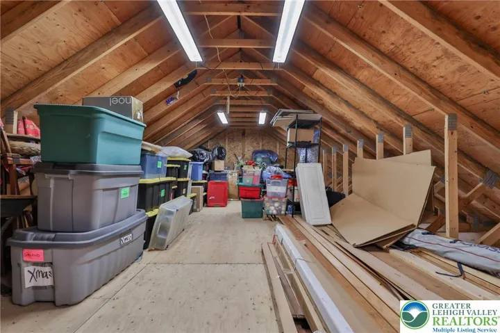 Second floor garage storage with full staircase (not a pull-down) and automatic vent