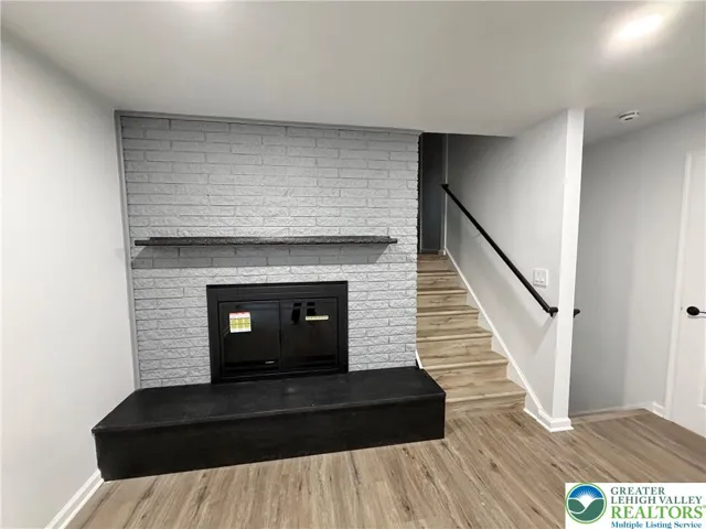 Wood Burning Fireplace just off Kitchen