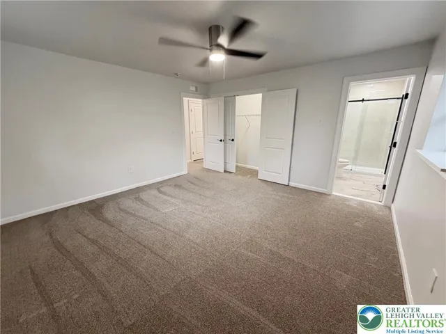 Upstairs Primary Bedroom with en suite Bathroom and Walk In Closet