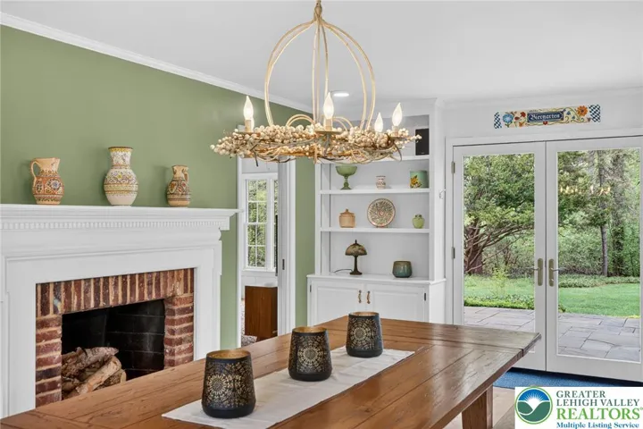 Built-in bookshelves; patio access; pocket door