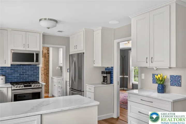 Kitchen with entrances to dining room/office and family room