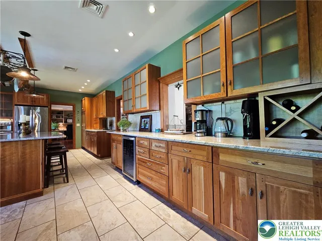 kitchen (wine frig/pantry/ample cabinet space)