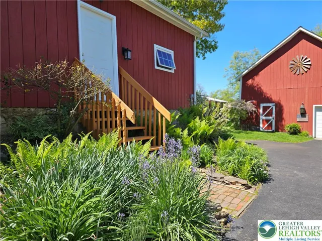 Door to garage; more perennial beds
