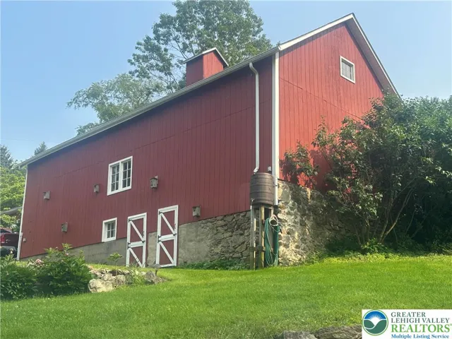 Barn and water barrel
