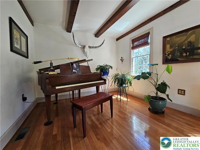 L-shaped continuation of dining room (this entire area could be a formal living room)