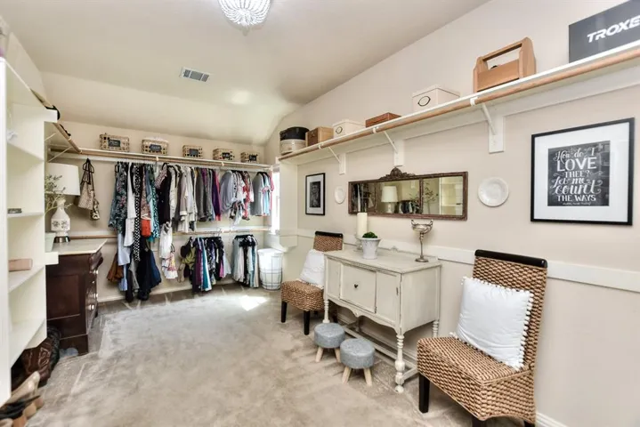 Notably larger primary closet... It took two photos to get everything... Great Space for organizing clothes and accessories