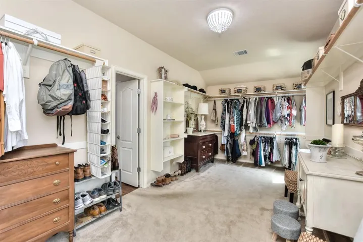 Second view of the Primary Closet.. Filled with storage solutions