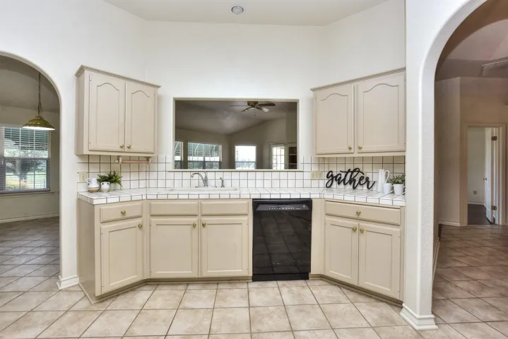 Two archways lead to the breakfast area on the left and the formal dining on the right...