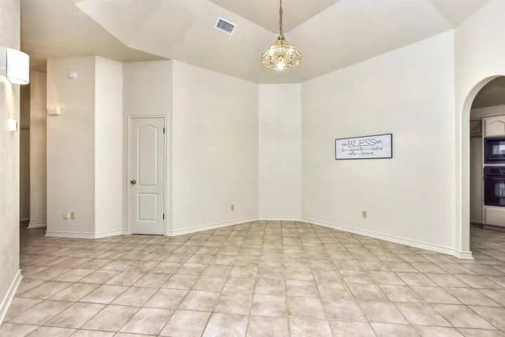 Or, if you have a beautiful dining room set, there is PLENTY of room here for your table, buffet, and china cabinet...The archway leads to the kitchen, so you have the perfect ability to serve food to your friends and family...