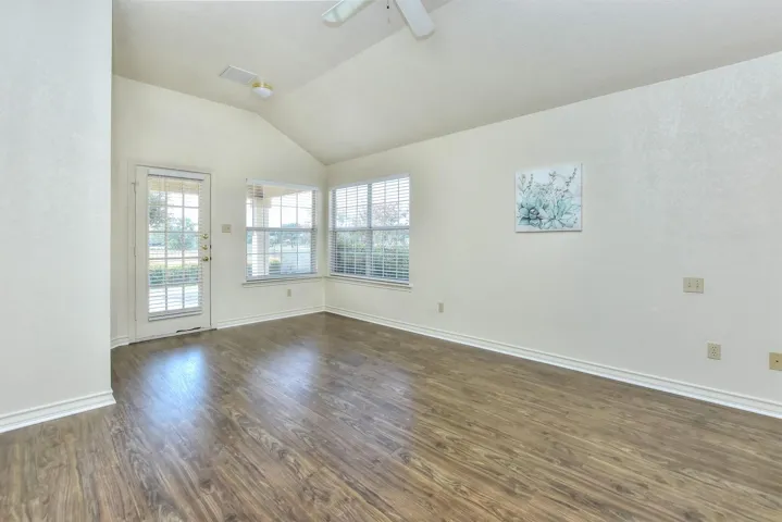 Primary suite also has a glass-paned door leading to the back patio....