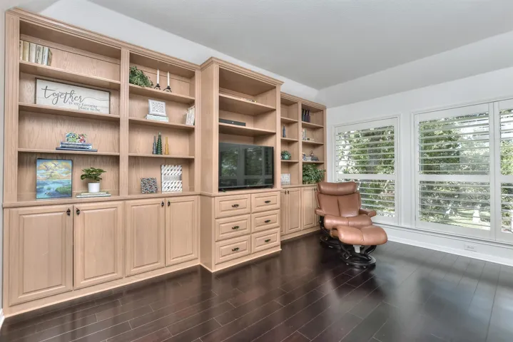 And right here in the primary suite are built in bookcases & cabinets....plenty of storage and a great place for your TV if you like watching TV before you go to sleep....