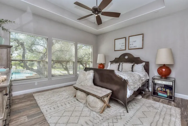 Primary Bedroom Main Floor overlooking pool 