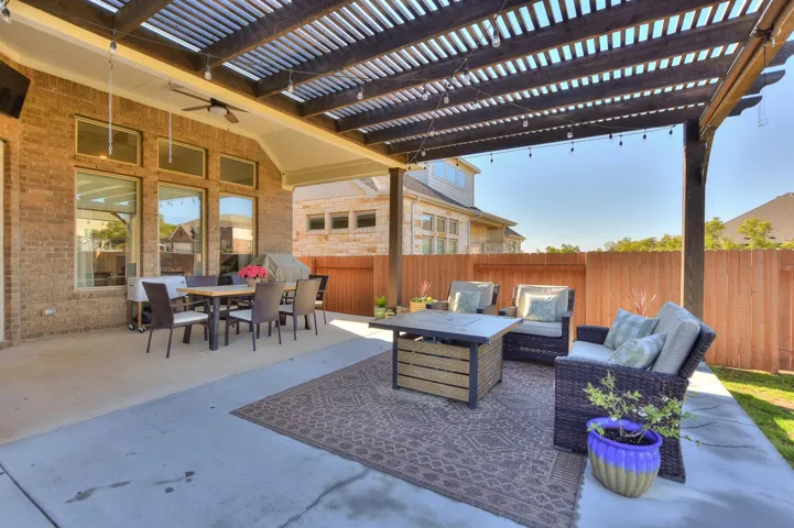 Extended concrete patio and wonderful pergola - Great for entertaining or playing with the kids
