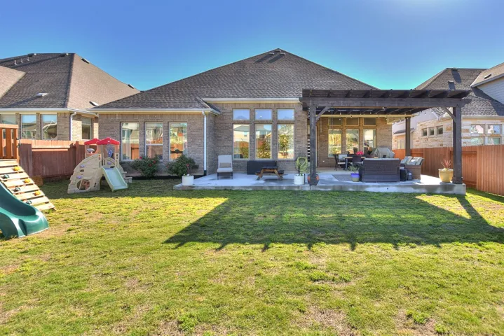 Great photo of the extended concrete patio and pergola