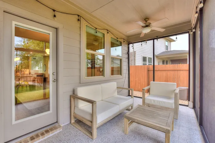Recently designed screened porch with tile flooring
