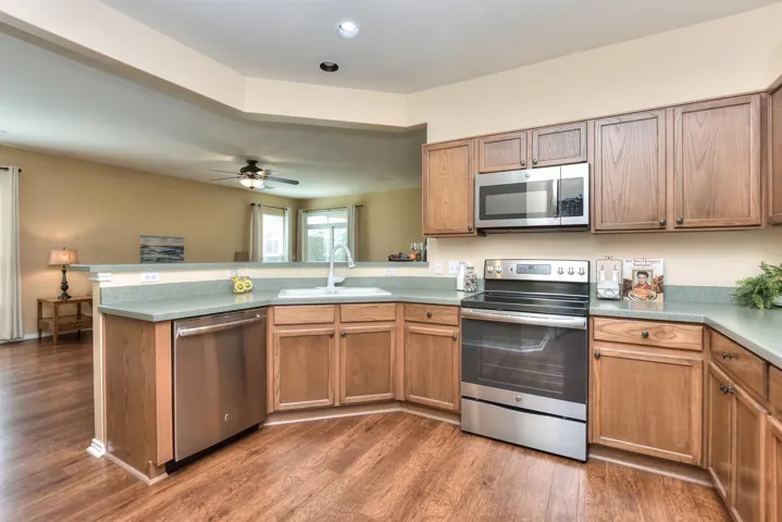 Immaculate.  The dishwasher, oven, & microwave were replaced when this Seller moved into the house.  While this oven is electric, there is still a gas stub behind the stove.  If YOU want gas cooking, all you have to do is get a gas stove....the plumbing is there for natural gas...