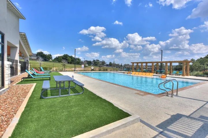 The community pool along with chaise lounge chairs to sunbathe if you dare...