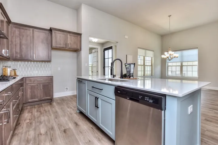 Whoever does the dishes isn't left out because they have a full view of the dining area and a full view of the family room...