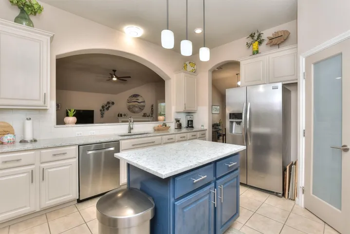 Abundant quartz countertops and island for meal prep  & entetaining!
