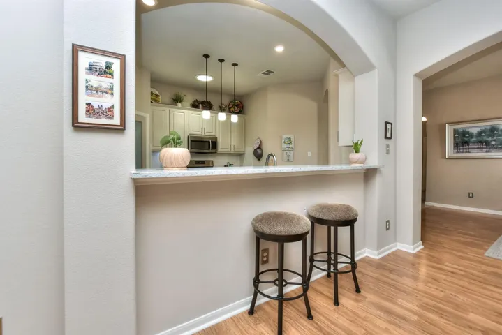 Breakfast bar welcomes you to pull up a chair!