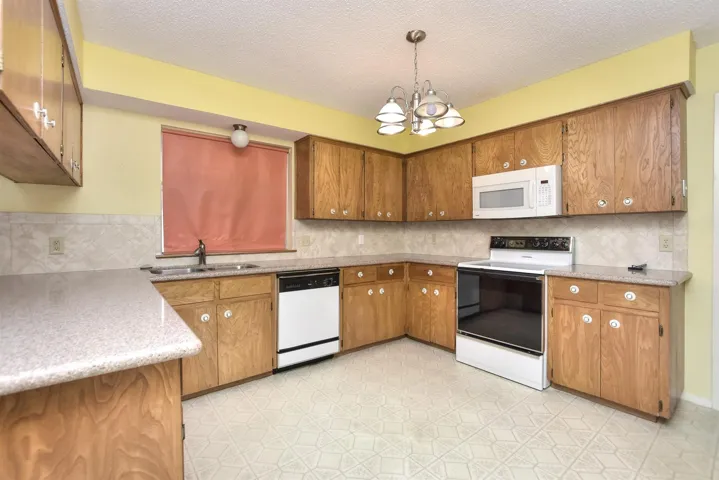 Kitchen has corian counter tops and is ready for your updates