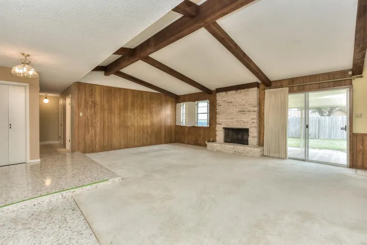 Huge living room with vaulted beamed ceiling