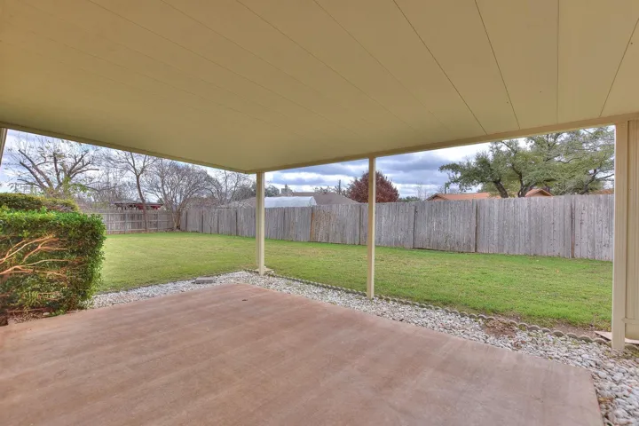 Huge covered back patio offers great space to relax or entertain
