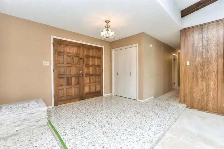 Beautiful, open entry with double wood doors